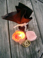 Bundle of 10 shekels, to pay taxes and "purchase" my candle and clay pot, each for 1 shekel (the coin in front).