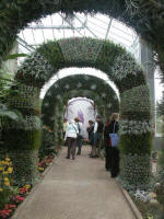Art Colonnade: four arches and columns accent a walkway dividing tropical and arid environments.
