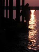 Thu photographs Vi leaning over to Ruth.